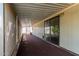 Covered patio with sliding glass doors and screened enclosure at 11596 W Sierra Dawn Blvd # 157, Surprise, AZ 85378