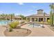 Community pool and spa with lounge chairs and a covered patio at 10851 E Le Marche Dr, Scottsdale, AZ 85255