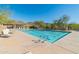 Inviting community pool with lounge chairs and mountain views at 10851 E Le Marche Dr, Scottsdale, AZ 85255