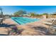 Community lap pool with plenty of lounge chairs at 10851 E Le Marche Dr, Scottsdale, AZ 85255