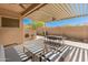 Relaxing covered patio with seating area and ceiling fans at 10851 E Le Marche Dr, Scottsdale, AZ 85255