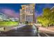 Modern high-rise building with gated entry and landscaping at 2211 E Camelback Rd # 505, Phoenix, AZ 85016