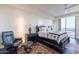 Spacious bedroom with dark wood furniture and city views at 2211 E Camelback Rd # 505, Phoenix, AZ 85016
