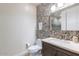 Stylish bathroom with pebble tile accent wall and modern vanity at 2211 E Camelback Rd # 505, Phoenix, AZ 85016