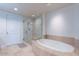 Luxurious bathroom with soaking tub and glass shower at 2211 E Camelback Rd # 505, Phoenix, AZ 85016