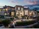 Luxury home with beautiful landscaping at dusk at 9848 E Parkside Ln, Scottsdale, AZ 85255