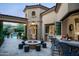 Outdoor patio with fire pit and seating area at 9848 E Parkside Ln, Scottsdale, AZ 85255