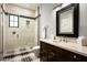 Modern bathroom with a large vanity, walk-in shower, and stylish fixtures at 9848 E Parkside Ln, Scottsdale, AZ 85255