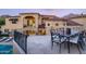 Outdoor patio with seating area and stunning mountain views at 9848 E Parkside Ln, Scottsdale, AZ 85255