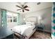 Bright bedroom with queen bed and teal accents at 9848 E Parkside Ln, Scottsdale, AZ 85255