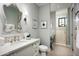 Bathroom boasts a vanity with a quartz countertop and a walk-in shower at 9848 E Parkside Ln, Scottsdale, AZ 85255