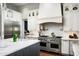 Gourmet kitchen boasts stainless steel appliances and marble countertops at 9848 E Parkside Ln, Scottsdale, AZ 85255