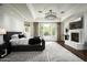 Bright main bedroom with hardwood floors, fireplace, and large windows at 9848 E Parkside Ln, Scottsdale, AZ 85255