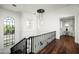 Elegant hallway with hardwood floors and chandelier at 9848 E Parkside Ln, Scottsdale, AZ 85255