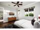 Bright bedroom with a cozy bed, dresser, and large window with mountain views at 9848 E Parkside Ln, Scottsdale, AZ 85255