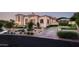 Tuscan-style home with landscaped grounds and driveway at 9848 E Parkside Ln, Scottsdale, AZ 85255