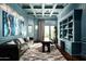 Elegant home office features built-in shelving, a large window, and comfortable seating at 9848 E Parkside Ln, Scottsdale, AZ 85255