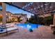 Inviting pool and spa area with lounge chairs and pergola at 9848 E Parkside Ln, Scottsdale, AZ 85255