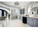 Spa-like bathroom with a soaking tub, walk-in shower, and dual vanities at 9848 E Parkside Ln, Scottsdale, AZ 85255