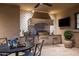 Elegant outdoor kitchen with built-in grill and tile at 9848 E Parkside Ln, Scottsdale, AZ 85255