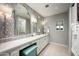Spa-like bathroom with double vanity and patterned tile at 9848 E Parkside Ln, Scottsdale, AZ 85255