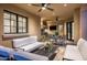 Outdoor kitchen with grill, seating and TV at 9848 E Parkside Ln, Scottsdale, AZ 85255