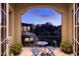 Evening view from private balcony with seating, offering a tranquil outdoor space at 9848 E Parkside Ln, Scottsdale, AZ 85255