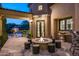 Backyard patio with fire pit and pool view at 9848 E Parkside Ln, Scottsdale, AZ 85255