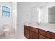 Clean bathroom with a vanity, toilet, and shower/tub combo at 8628 W Solano Dr, Glendale, AZ 85305