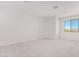 Bright and airy bedroom with large window and plush carpeting at 8628 W Solano Dr, Glendale, AZ 85305