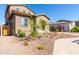 Two-story house with a landscaped yard and wooden gate at 8628 W Solano Dr, Glendale, AZ 85305