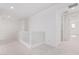 Bright hallway with white walls and carpeted floors at 8628 W Solano Dr, Glendale, AZ 85305