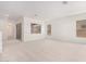 Bright living room with large windows and carpeted floor at 8628 W Solano Dr, Glendale, AZ 85305