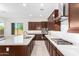 Modern kitchen with gas cooktop and large island at 8628 W Solano Dr, Glendale, AZ 85305