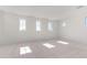 Bright and airy bedroom with plush carpeting and multiple windows at 8628 W Solano Dr, Glendale, AZ 85305