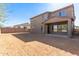 Large backyard with a patio and a two-story house at 8628 W Solano Dr, Glendale, AZ 85305