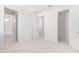Bright bedroom with carpet flooring and access to a bathroom at 8628 W Solano Dr, Glendale, AZ 85305