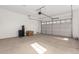 Spacious garage with overhead door and window at 8628 W Solano Dr, Glendale, AZ 85305
