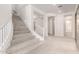 Modern staircase with white railing and carpeted steps at 8628 W Solano Dr, Glendale, AZ 85305