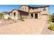 Two-story house with a three car garage and landscaped yard at 8628 W Solano Dr, Glendale, AZ 85305