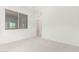 Bedroom with window and door to hallway at 8628 W Solano Dr, Glendale, AZ 85305