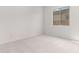 Bright bedroom featuring neutral walls and carpet at 8628 W Solano Dr, Glendale, AZ 85305