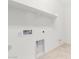 Laundry room with shelving and tile flooring at 8628 W Solano Dr, Glendale, AZ 85305