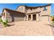 Two-story house with a three car garage and a paved driveway at 8628 W Solano Dr, Glendale, AZ 85305
