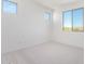 Spacious bedroom with neutral carpeting and large windows at 8628 W Solano Dr, Glendale, AZ 85305