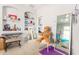 Bedroom with eclectic decor, built-in shelves, and a full-length mirror at 3702 W Riordan Ranch Rd, Phoenix, AZ 85083