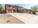 Large two story home with three car garage and desert landscaping at 3702 W Riordan Ranch Rd, Phoenix, AZ 85083