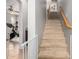 Carpeted staircase with a wooden handrail leading to the upper level at 3702 W Riordan Ranch Rd, Phoenix, AZ 85083