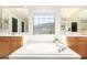 Primary bathroom with double vanities, soaking tub, and mountain views at 3702 W Riordan Ranch Rd, Phoenix, AZ 85083