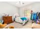 Bedroom with a dresser, full-size bed, and ample closet space at 3702 W Riordan Ranch Rd, Phoenix, AZ 85083
